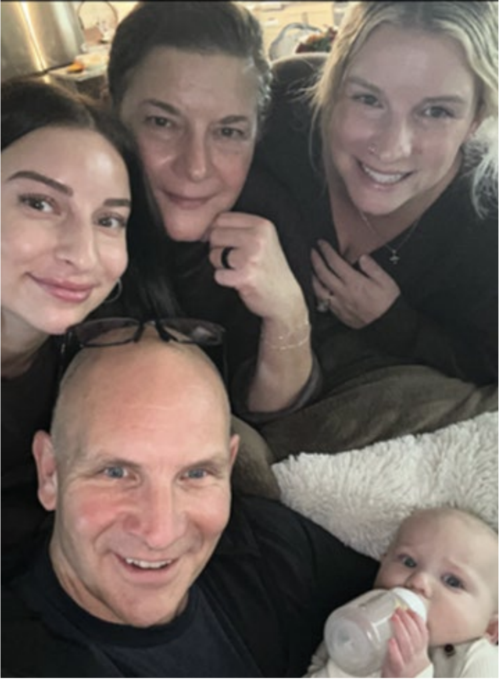 Family holding a child